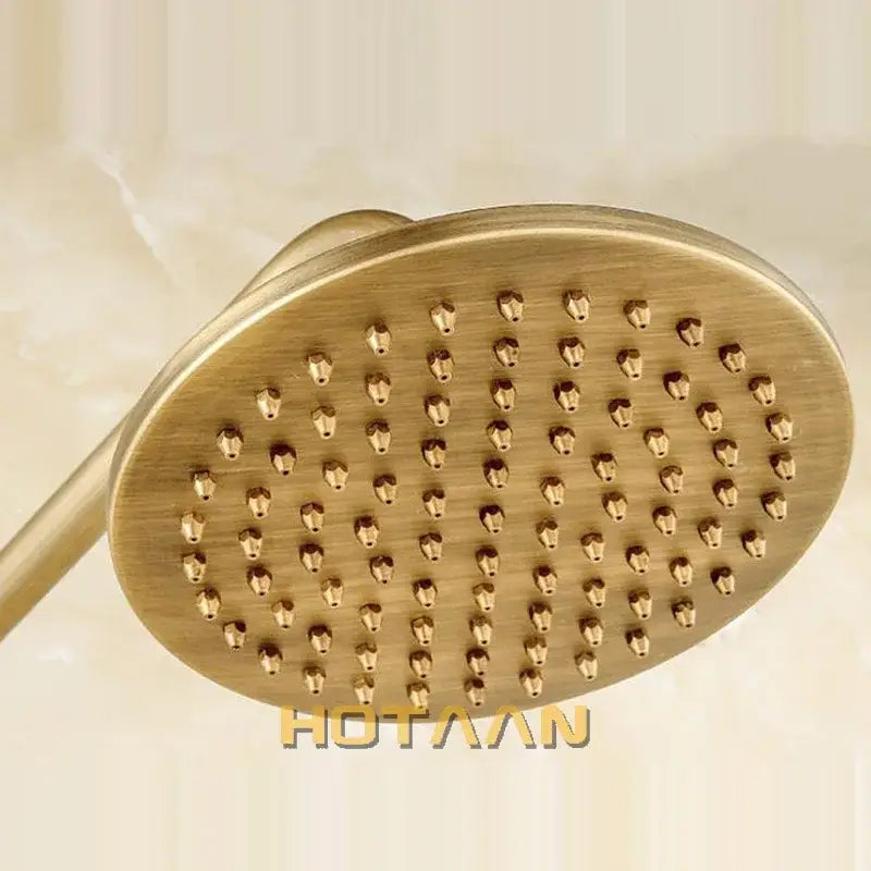 Decorbites 8 inch copper round overhead rain shower head in antique brass finish with brass-finished oval nozzles