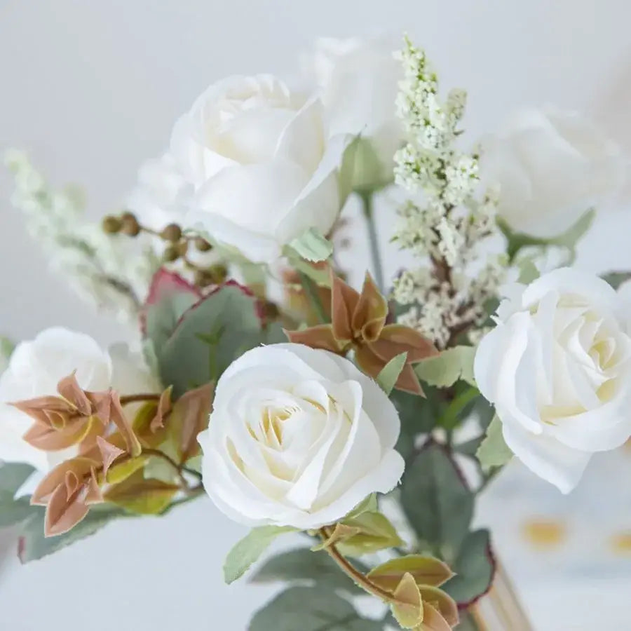 Delicate white artificial roses with soft petals and green leaves in the DecorBites 8-head pink peony silk bouquet