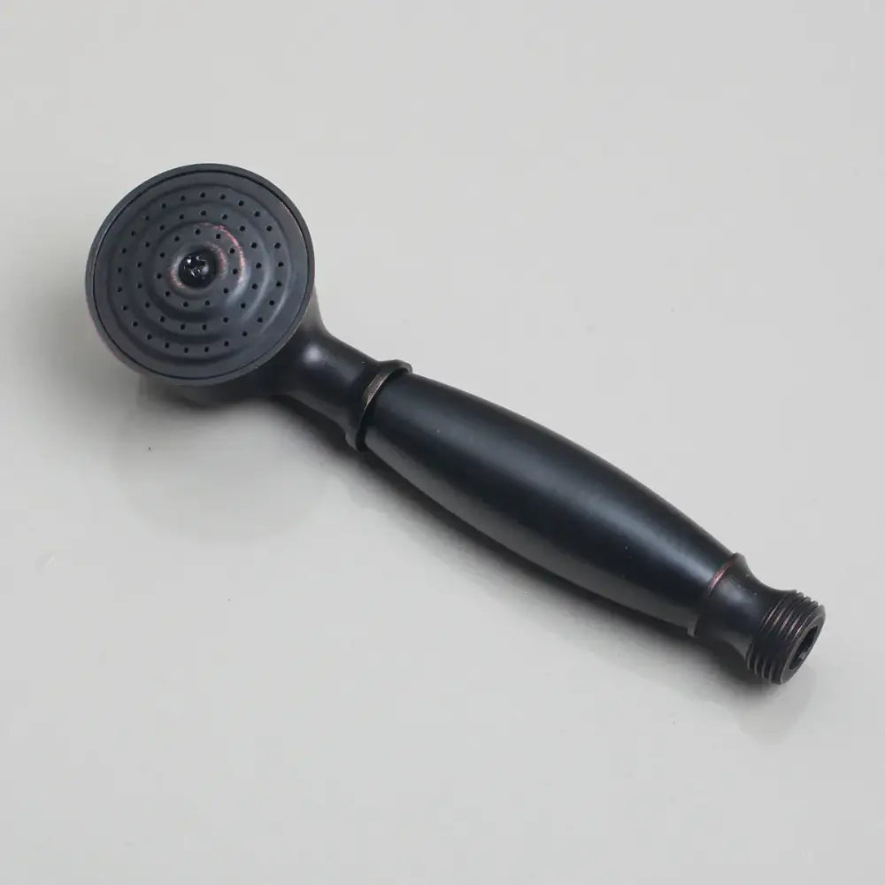 Black matte handheld showerhead with circular spray face and threaded connection in DecorBites shower faucet set