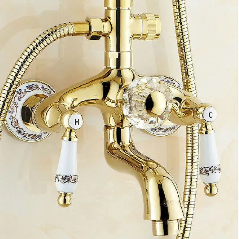 Gold-finished DecorBites™ 8 inch shower tub faucet set with crystal knob white ceramic handles and ornate detailing