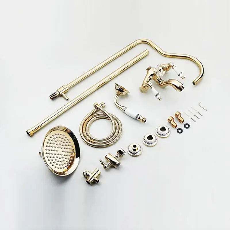 Gold-finished brass decorbites 8 inch shower tub faucet set with ornate design and matching rainfall showerhead