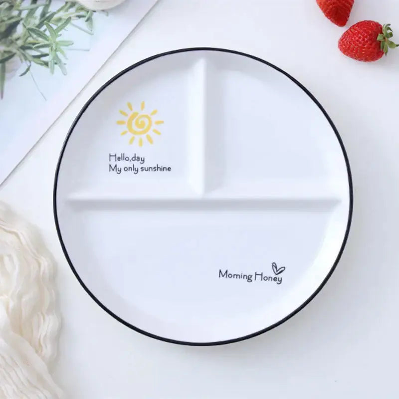 White ceramic 8 inch round grid plate with black rim and yellow sun illustration for solo dining or family breakfast