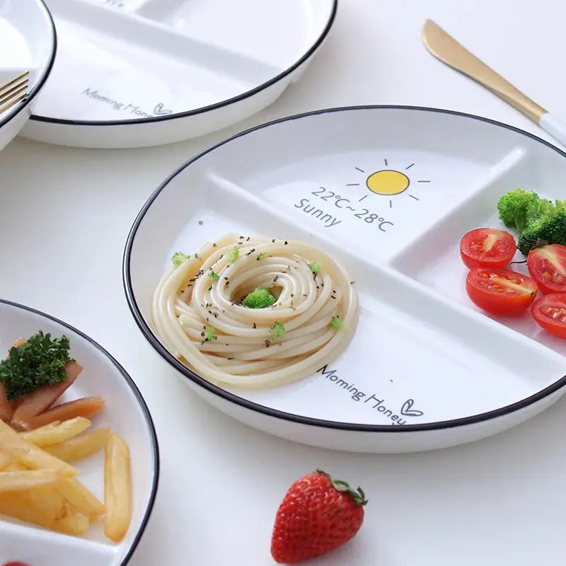 White ceramic round grid plate with black rim sun graphic and morning honey text ideal for solo dining or breakfast