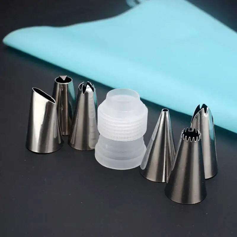 Set of stainless steel decorating tips in a clear container as part of decorbites 8pc silicone piping bag and 6pc nozzle set