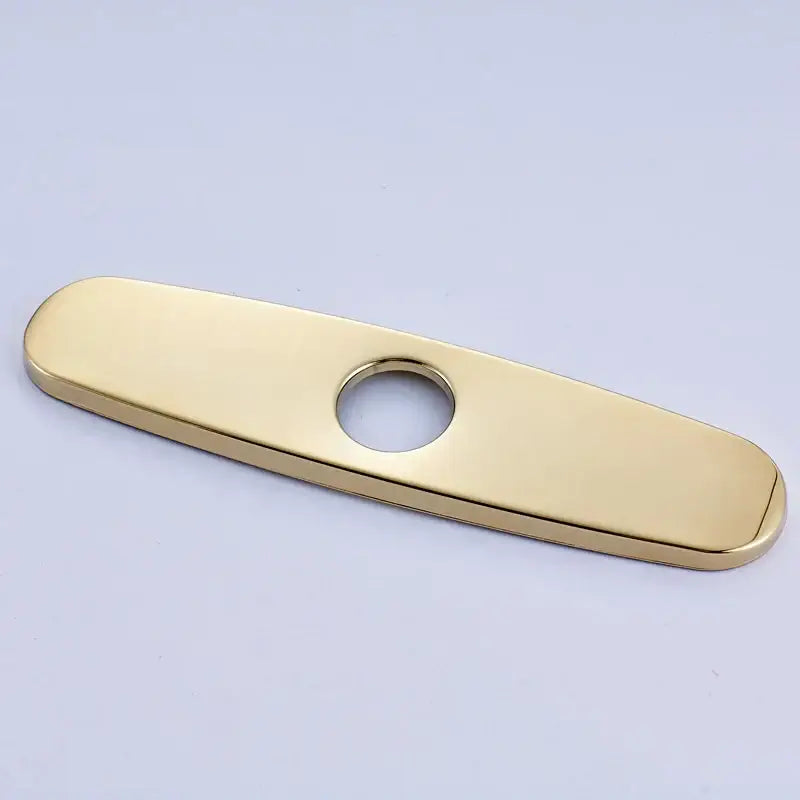 Gold-colored metal DecorBites™ 9.6-inch hole cover for kitchen sink faucet with central circular sink faucet hole