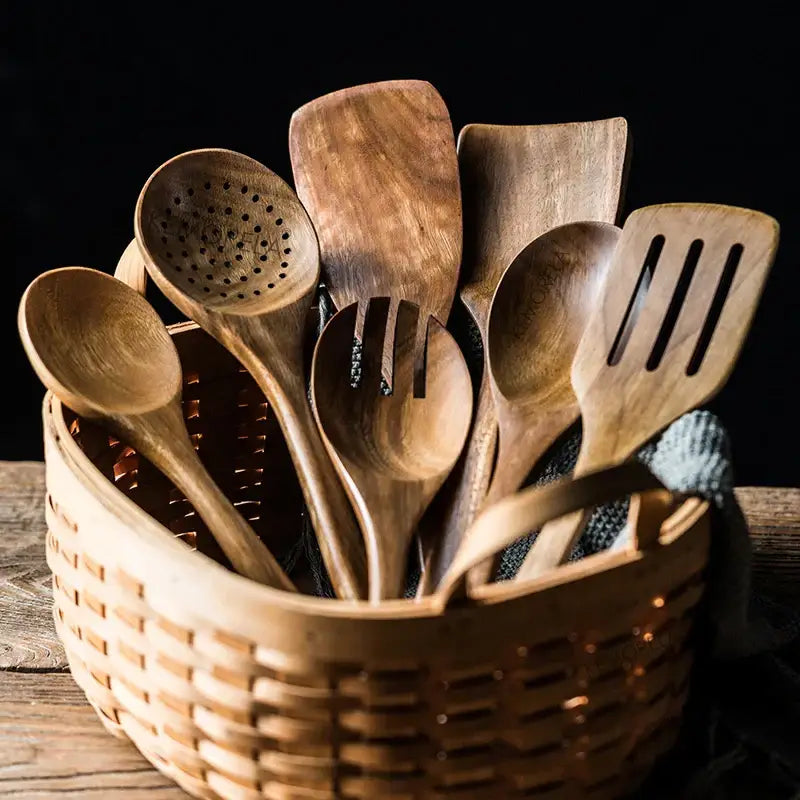Decorbites 9-piece wooden cooking utensils set with teak holder featuring rustic natural grain and draining spoons