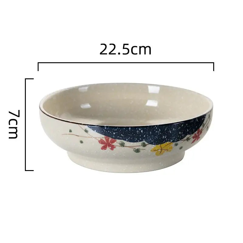 Cream-colored retro ceramic ramen noodle bowl with navy blue speckled band and colorful floral rim design