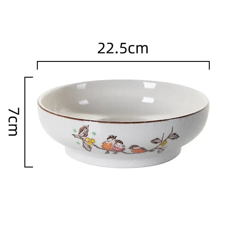 A white ceramic ramen noodle bowl with a brown rim and bird illustrations for Japanese style soup by decorbites