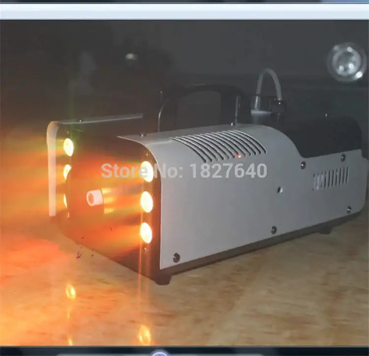 Silver and black 900w fog machine with illuminated orange lights, decorbites™ ideal for weddings parties and dj shows