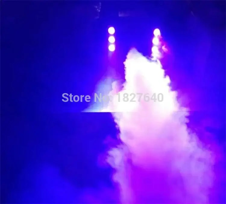 Decorbites 900w rgb wireless fog machine emitting vibrant purple and blue swirling smoke under bright spotlights