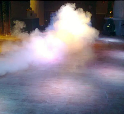 A swirling cloud of white and purple smoke from the decorbites 900w smoke machine with wireless remote control on wooden floor