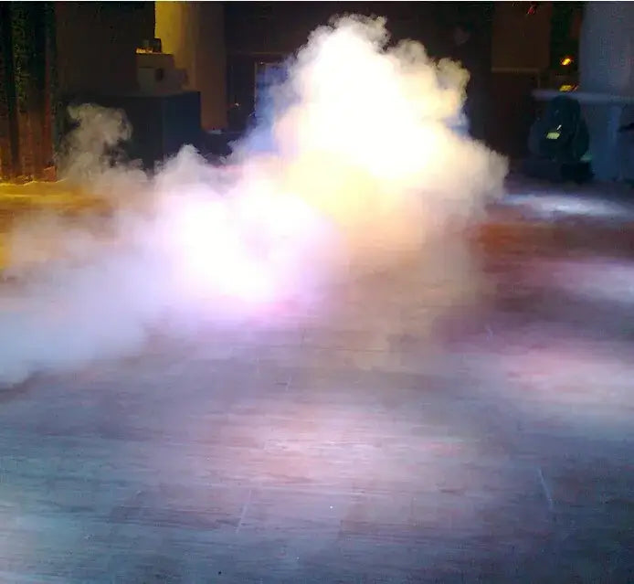 A swirling cloud of white and purple smoke from the decorbites 900w smoke machine with wireless remote control on wooden floor