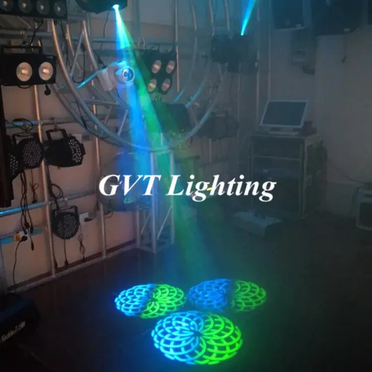 Decorbites 90w led spot moving head projects green and blue laser lights with intricate circular patterns on the floor