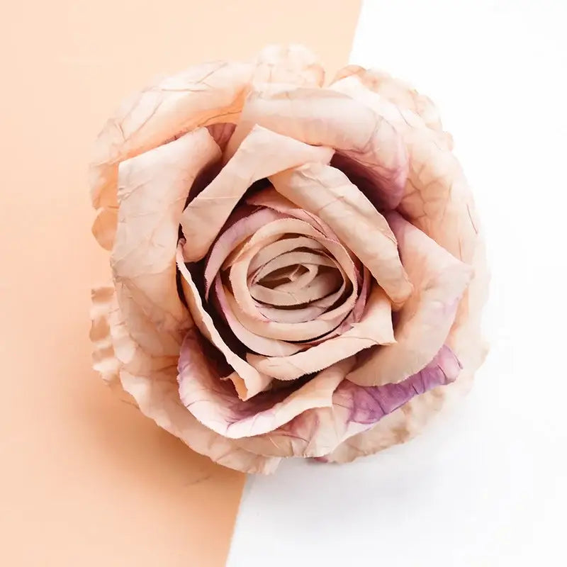 A delicate peach and lavender 9cm silk roses artificial flowers with crinkled layered petals for home decor and gifts