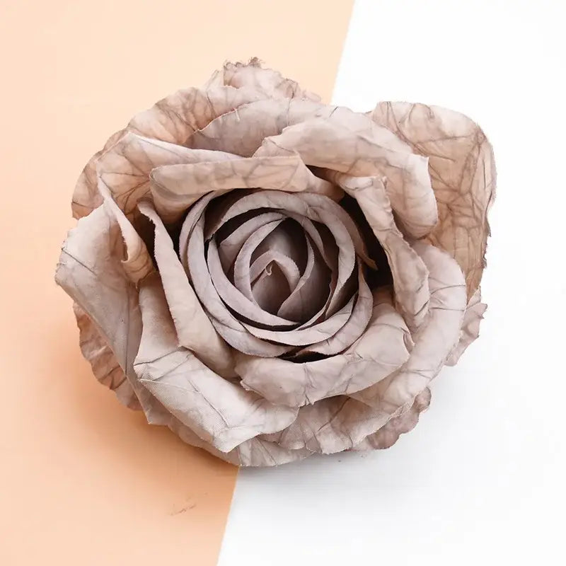A delicate beige 9cm silk rose with intricate folds from DecorBites™ artificial flowers for home decor and gifts