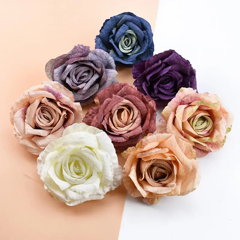 A collection of decorbites™ 9cm silk roses artificial flowers in muted deep blue purple blush pink and cream hues