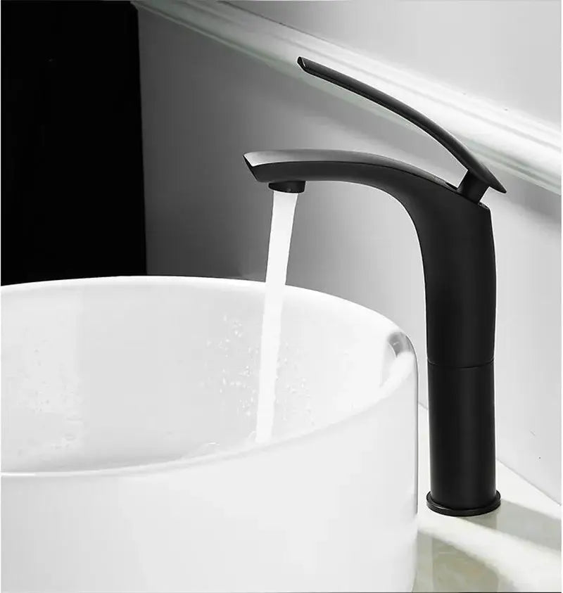 Black matte-finish modern faucet with sleek curved spout paired with decorbites stainless steel gold dustbin