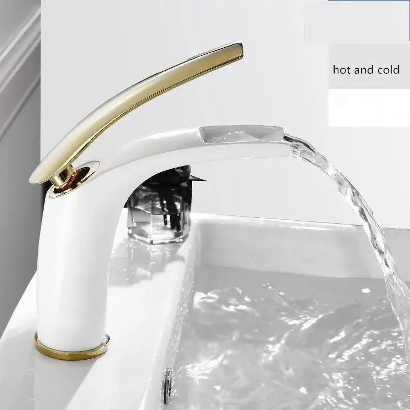 White ceramic faucet with sleek gold tone spout and handle complements stainless steel gold dustbin by DecorBites