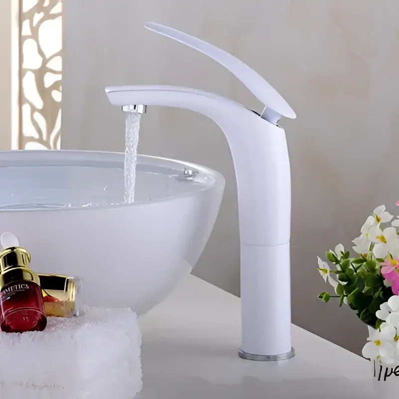 White modern faucet with sleek curved spout and chrome accents paired with decorbites™ 9l stainless steel gold dustbin