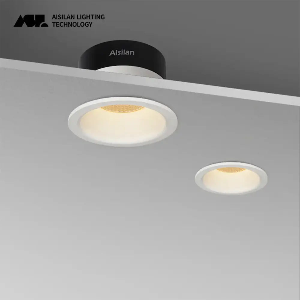Modern DecorBites™ led recessed downlight with white circular design and black base emitting warm ambient light