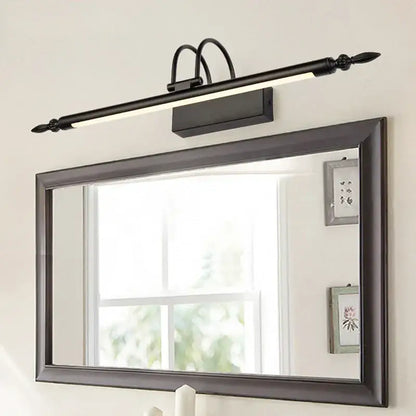 Black wrought iron decorbites 9w led mirror light with elongated design and decorative finials for bathroom vanity wall use