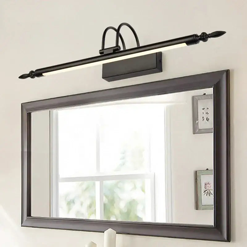 Black wrought iron decorbites 9w led mirror light with elongated design and decorative finials for bathroom vanity wall use
