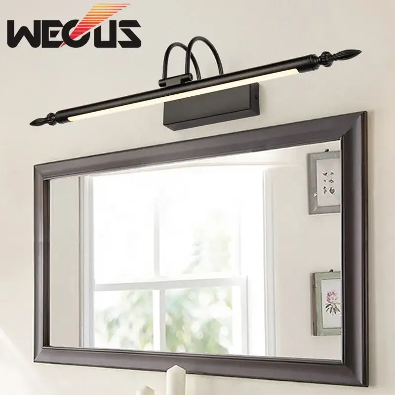 Black wrought iron decorbites 9w led mirror light with sleek elongated design and decorative finials for bathroom vanity