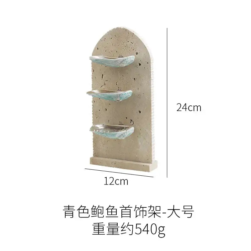 Beige concrete wall-mounted decorbites abalone shell jewelry organizer with three tiers holding light blue shells