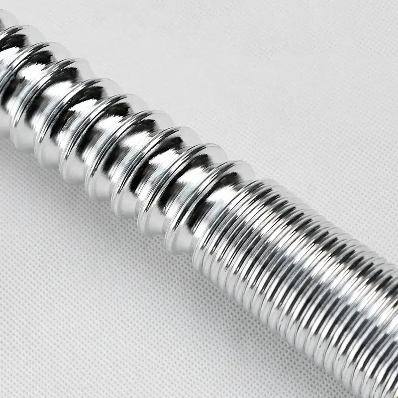 A shiny metallic silver coiled spring with ribbed texture in decorbites abs kitchen sewer pipe for sink and basin drainage