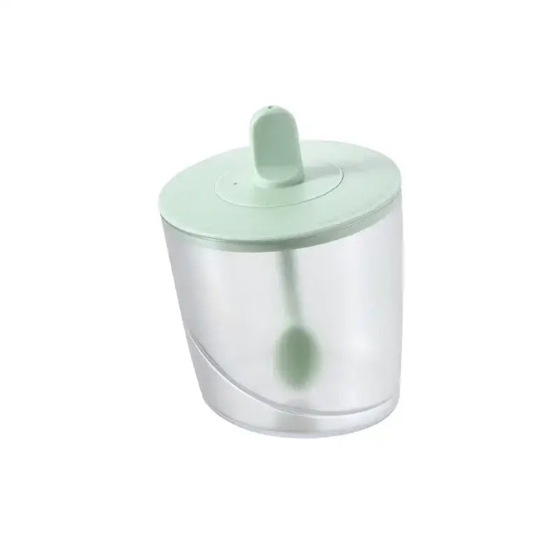 A clear plastic decorbites abs spice jar set with light green lid and spoon designed for sugar salt and pepper