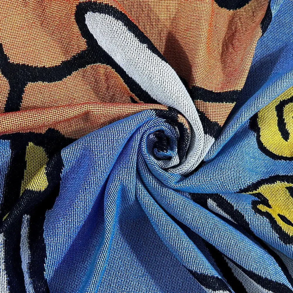 Blue and orange patterned scarf with cartoon design featured in decorbites abstract aesthetic tapestry sofa blanket