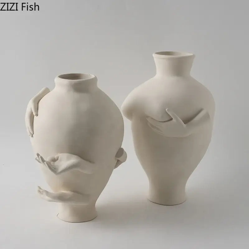 Cream-colored decorbites abstract art ceramic vase featuring sculpted human forms and hands for desk decoration