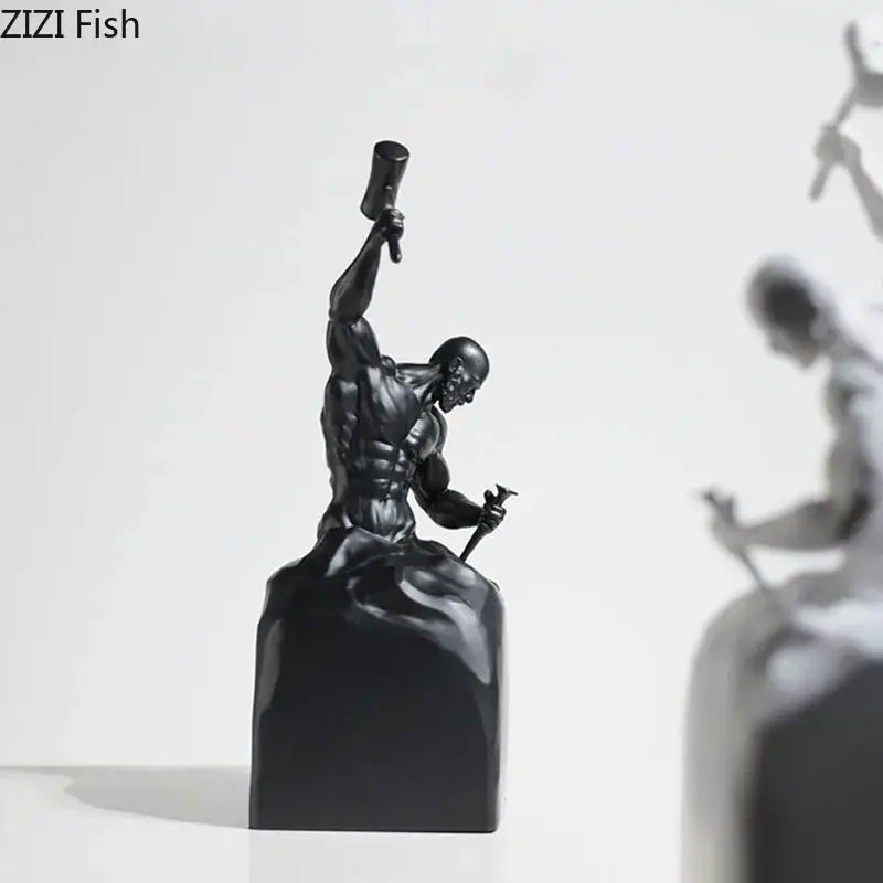 Black resin DecorBites™ character statue of a muscular artisan with hammer and chisel for sculpting oneself abstract artworks