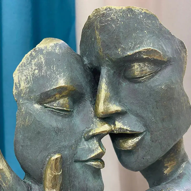 Bronze and gold-toned decorbites abstract art couple mask sculpture depicting two faces in intimate embrace for interior decor