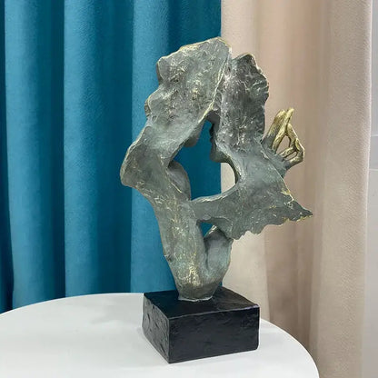 DecorBites abstract art couple mask statue figurines with textured metallic gray and gold accents on black base for decor