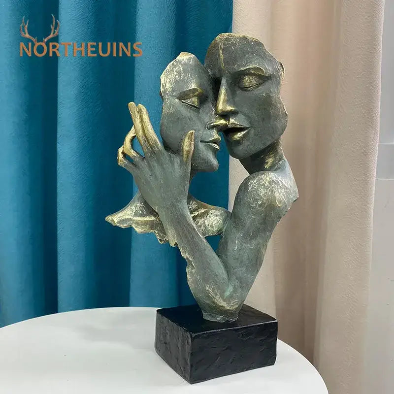 DecorBites abstract art couple mask bronze and gold-toned sculpture of two intertwined faces on black base for decor