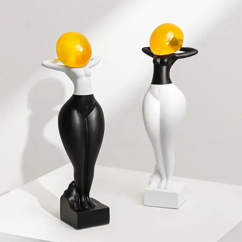 Decorbites abstract art female body decor resin figurines in black and white with glossy yellow spheres balanced on heads