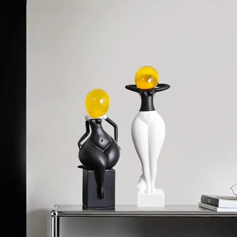 Decorbites abstract art female body decor figurines in black and white resin with glossy yellow sphere heads