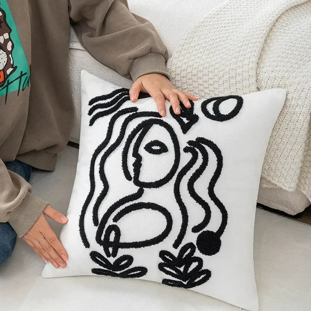 White cushion cover with black embroidered abstract art line design from decorbites abstract art collection