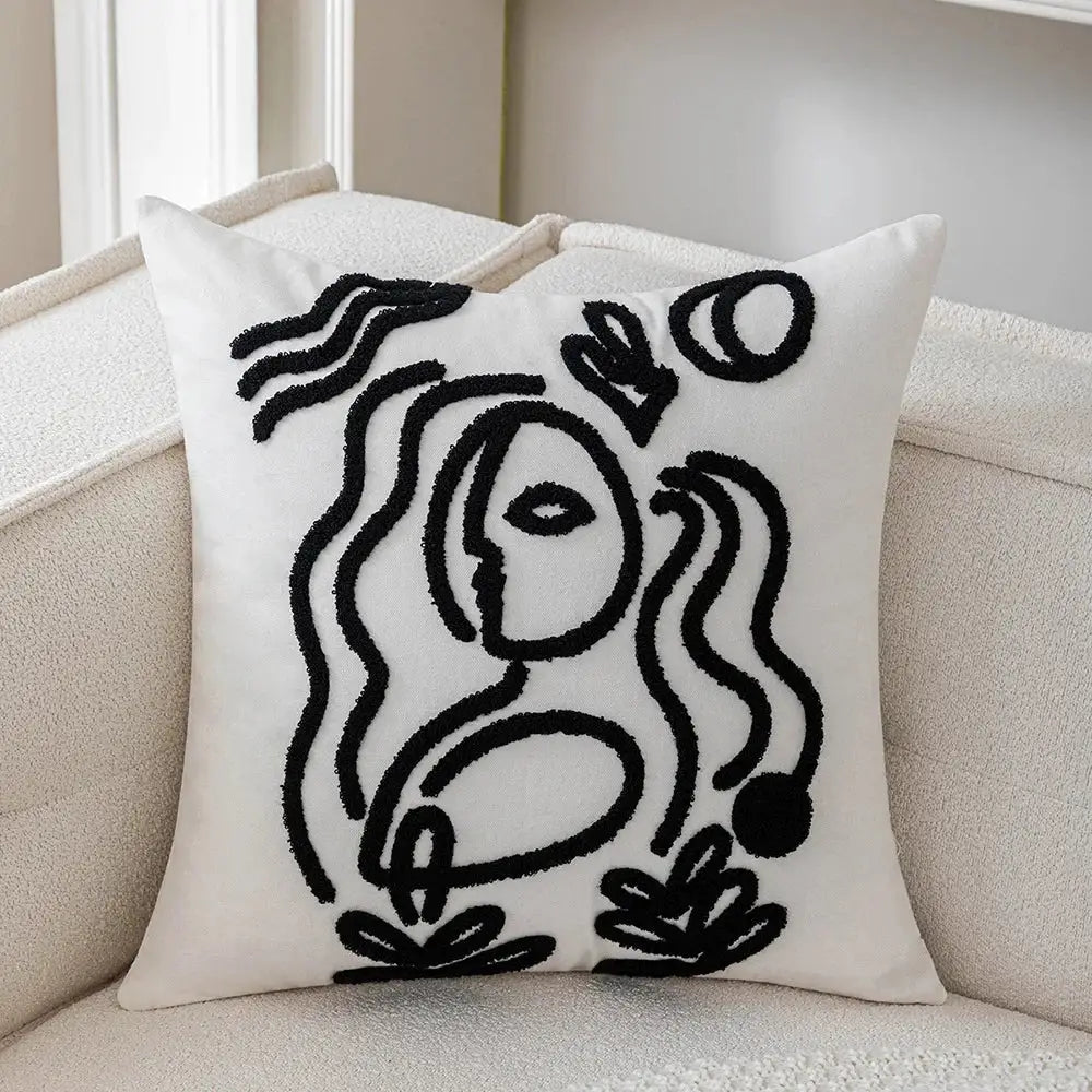 White cushion cover with black embroidered abstract art line face design from decorbites abstract art collection