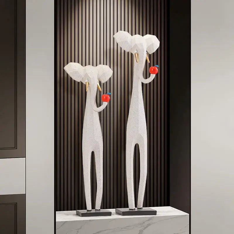 White geometric elephant sculptures with gold tusks on black bases for decorbites abstract art living room decor