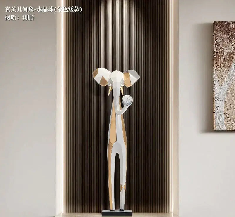 A sleek modern geometric elephant sculpture in white and gold resin for living room decorbites abstract art decor