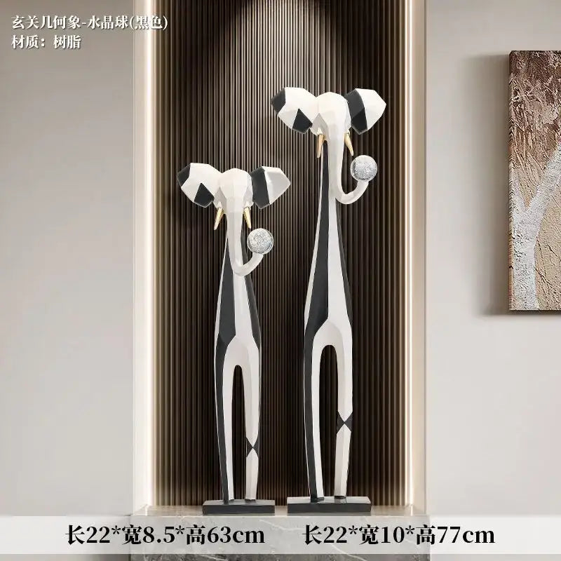 Two modern abstract art elephant sculptures with black white geometric patterns and gold tusks for living room decorbites abstract art