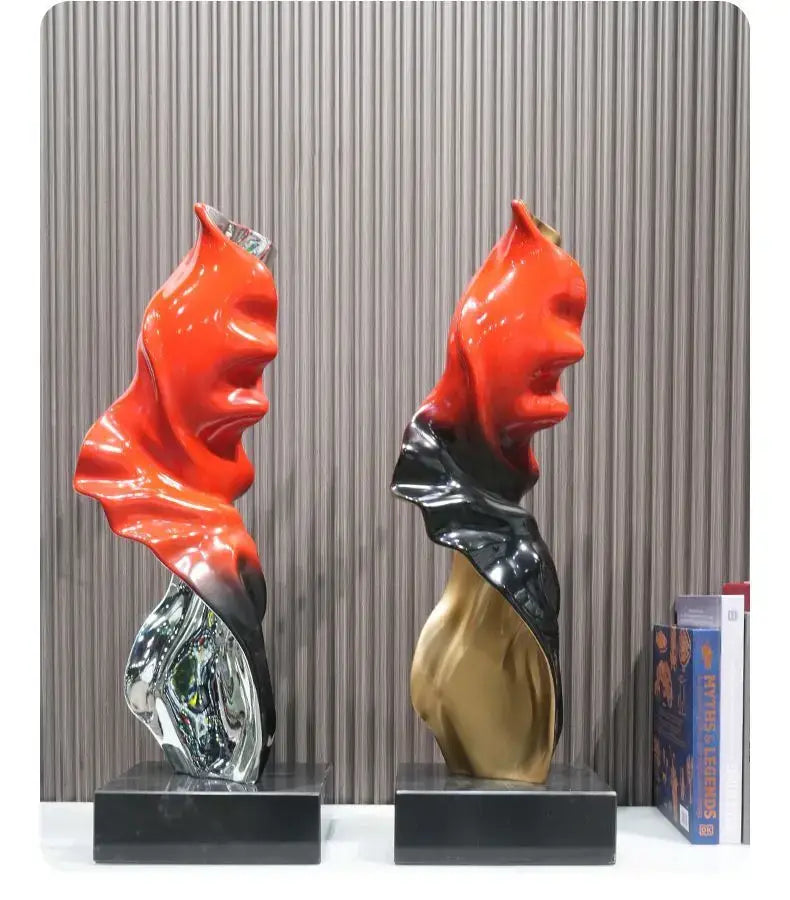 Two decorbites abstract art ribbon sculptures in red silver and black gold on black pedestals for large living room decor