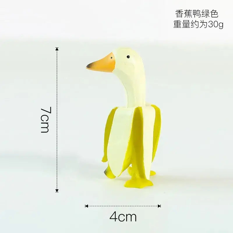 DecorBites™ abstract banana duck sculpture decorative figurine in pale yellow plastic with orange beak for home decoration