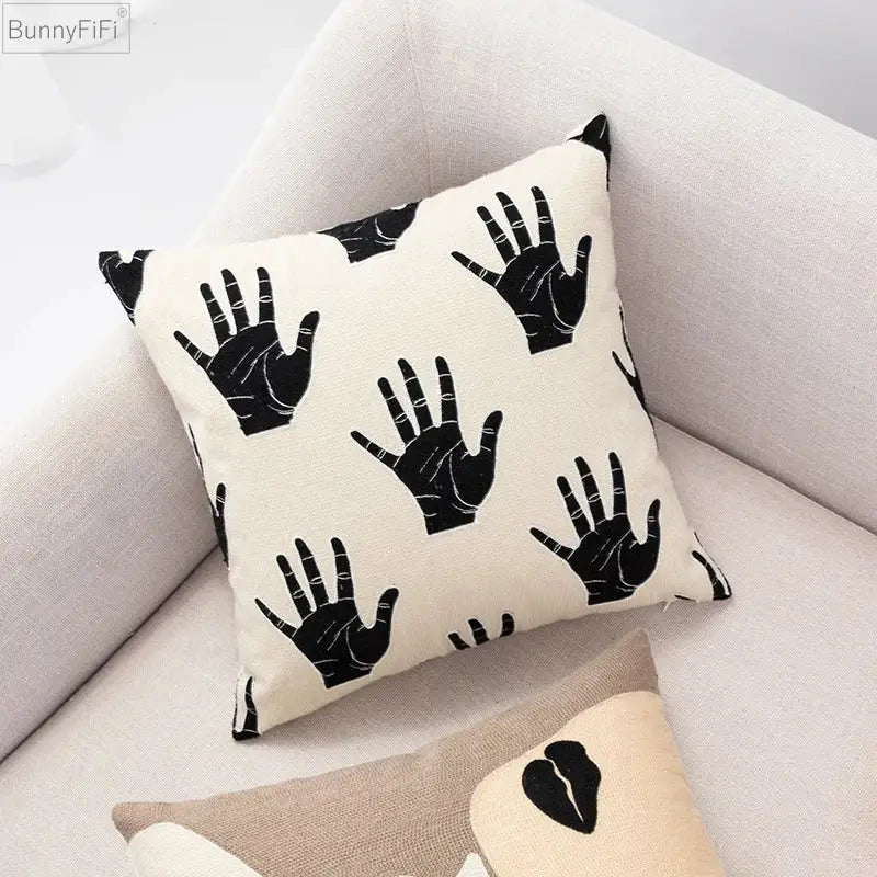 Cream-colored decorbites abstract beige coffee brown knot cushion cover with black hand print pattern and soft fabric texture