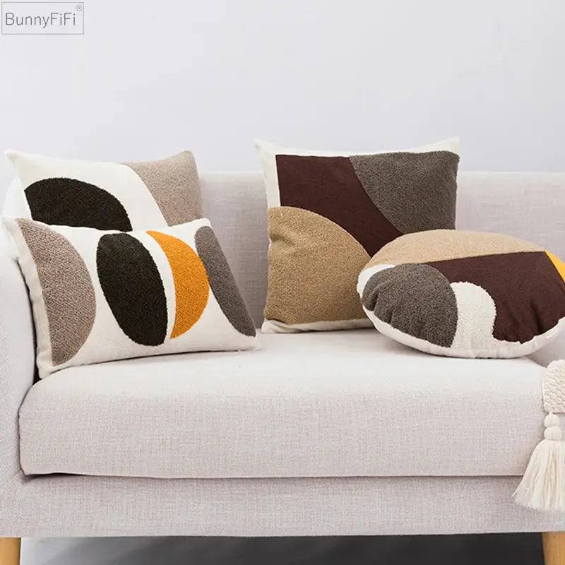 Set of three decorbites abstract beige coffee brown knot cushion covers on a light gray sofa for sofa bed decor