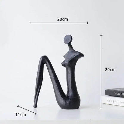 DecorBites™ abstract black metal female figure sculpture with smooth glossy finish for elegant home decor accessory