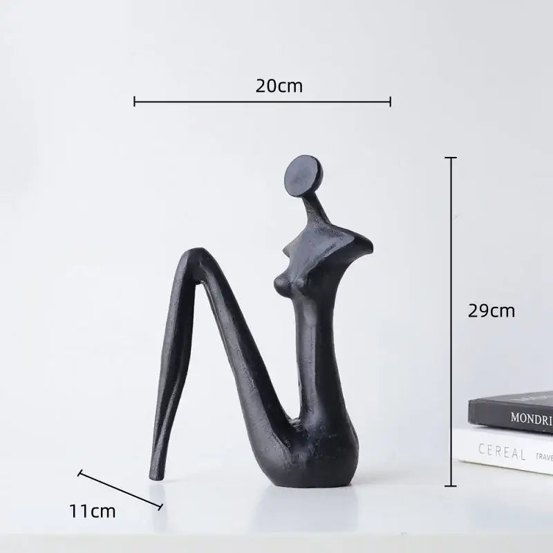 DecorBites™ abstract black metal female figure sculpture with smooth glossy finish for elegant home decor accessory
