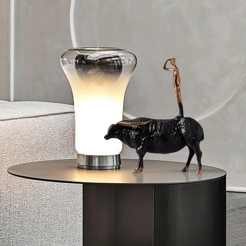 Decorbites abstract black yak golden metal sculpture featuring a standing figure on the back for decorative use